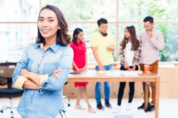 istock Young Asian woman looking at camera with self-confidence and det 874165980