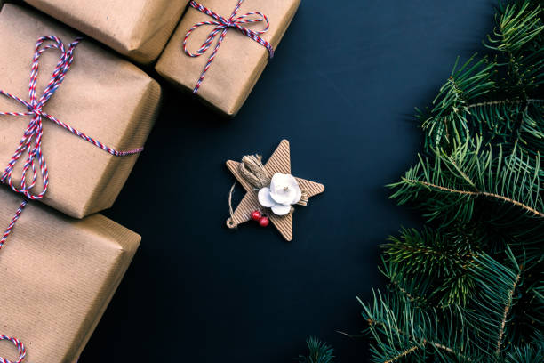 istock Christmas gift boxes and fir tree. Top view with copy space for your text 874172652