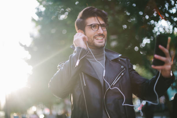istock Handsome man listening to some music 874176172