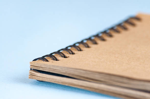 istock Notepad for drawing from recycled paper. On a spiral mount. for sketching. Selective focus 874176470