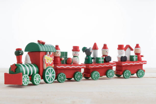 istock toy train on wooden background for christmas 874186014
