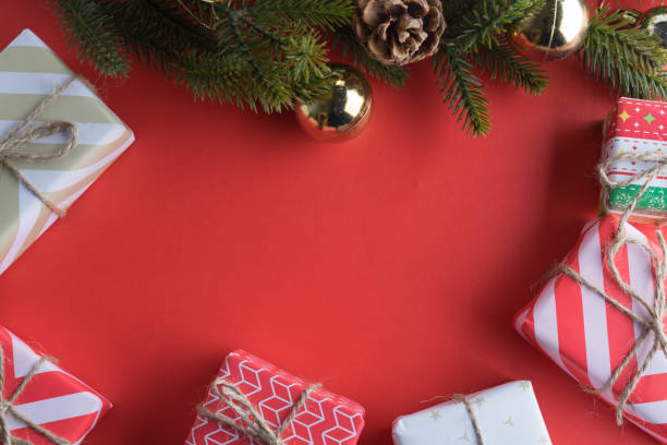 istock christmas gift presents in decorative boxes on red background 874186330