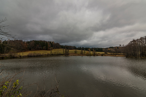 Sychrov pond near Horni Studenky village in dark autumn day