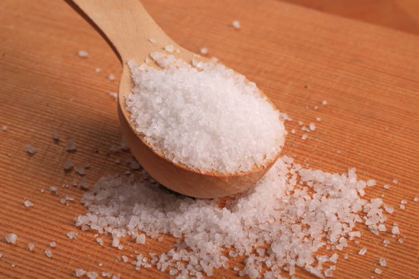 istock Ocean salt in a wooden spoon 874189686