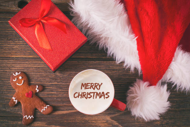 istock Christmas coffee and gingerbread cookies on rustic wooden table 874189964