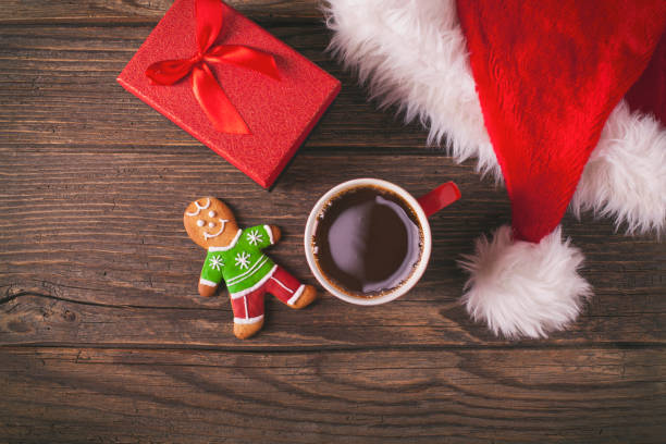 istock Christmas coffee and gingerbread cookies on rustic wooden table 874190290