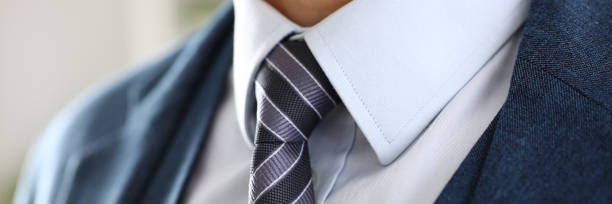 istock Male arm in blue suit set tie closeup 874190506