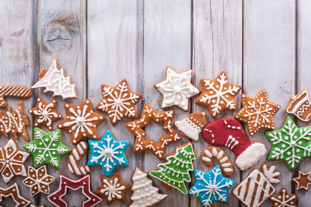 istock Christmas cookies on white wooden table 874191256