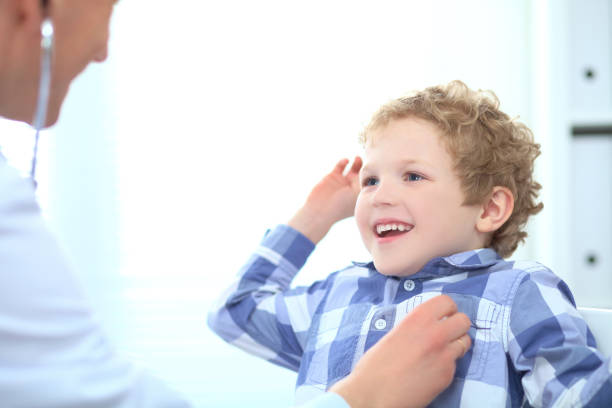 istock Doctor examining a child patient teeth by  orthodontic tools. 874193912