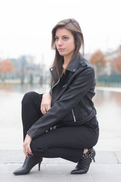 istock Fashion model posing in a city 874197606