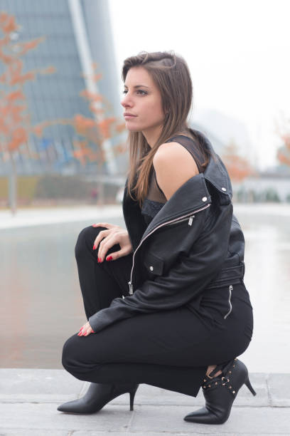 istock Fashion model posing in a city 874197640