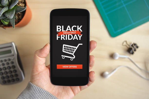 istock Hand holding smart phone with Black Friday concept on screen 874200820