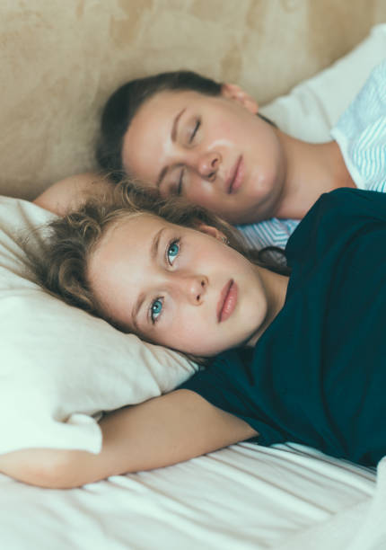 istock Little girl has insomnia, cant sleep. 874201096