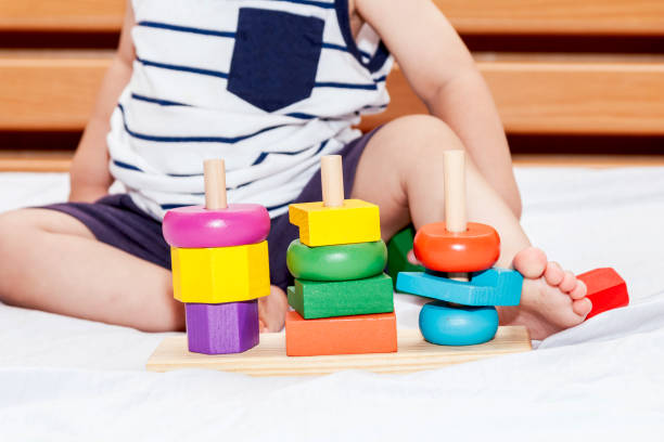 istock Baby boy playing with wooden blocks 874201448