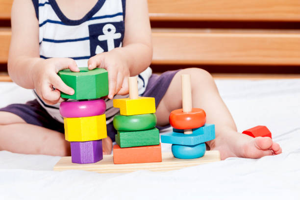 istock Baby boy playing with wooden blocks 874201464