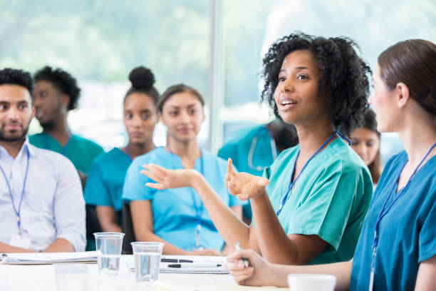istock Confident doctor answers question during healthcare conference 874205380