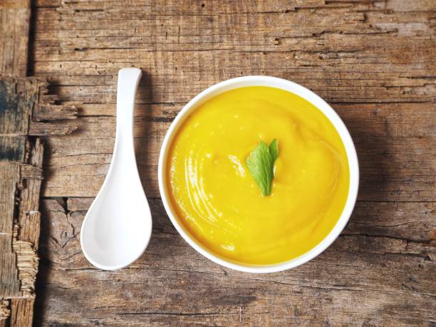 Soup pumpkin with a spoon