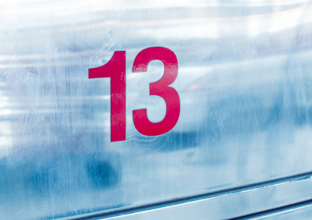 istock No. 13 on metal background 874211946