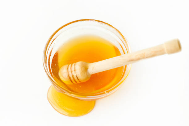 istock Drizzler in Bowl with Honey and Splash 874218394
