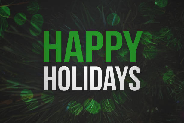Photo of Happy Holidays Text with Pine Branches Background and Bokeh Lights