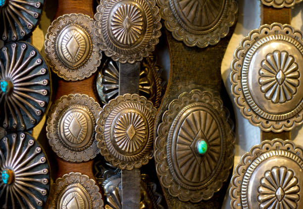 istock Vintage Southwest Native American Silver Belts Hanging (Close-Up) 874218956