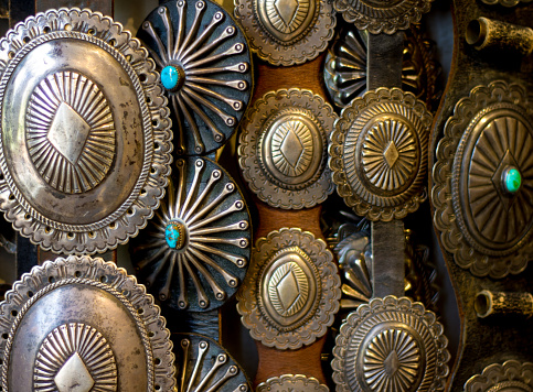 Vintage Southwest Native American Silver Belts Hanging (Close-Up)