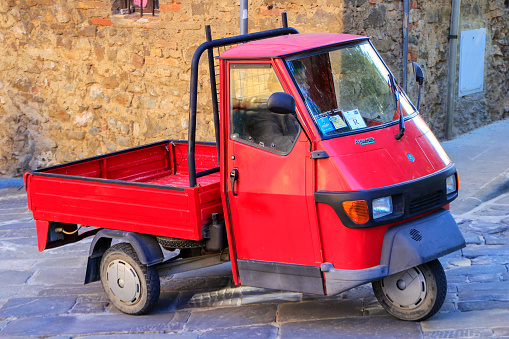 Red Piaggio Ape 50 In Montalcino Town Tuscany Stock Photo - Download Image  Now - Car, Piaggio Ape, Ape - iStock