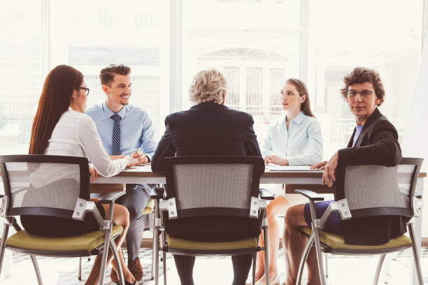 istock Confident woman looking at camera at meeting_tone 874231878