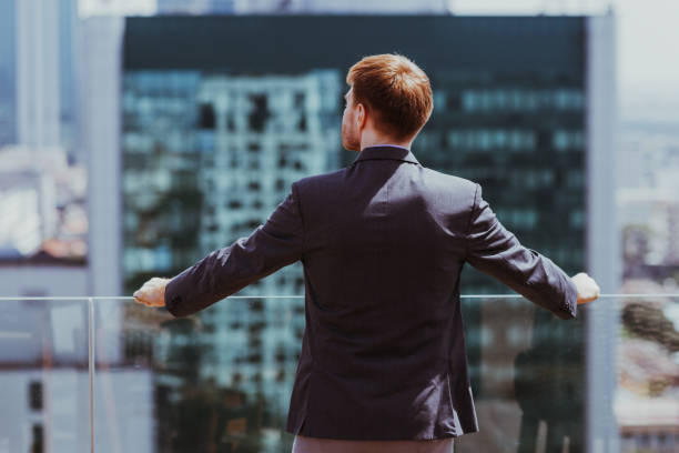 istock Businessman Looking at City 874237376