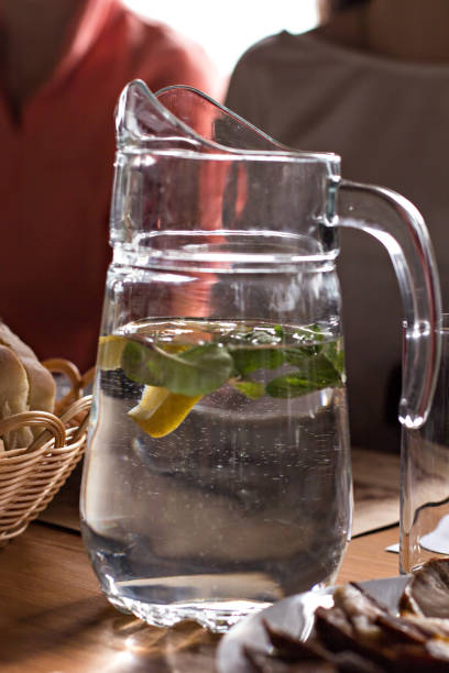 istock Decanter with water with lemon and mint 874244010