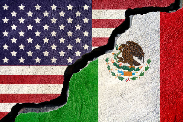 istock Concept american and Mexico flag on cracked background 874244158