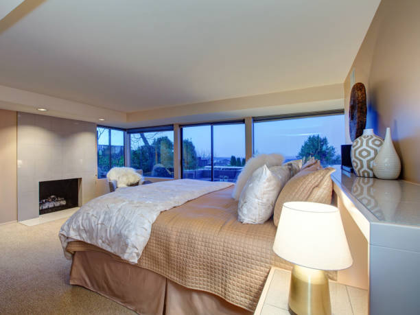 istock Lovely bedroom design with fireplace and exit to patio 874244292