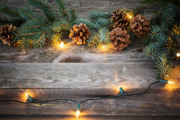 istock Christmas fir branches with cones and garland 874245038