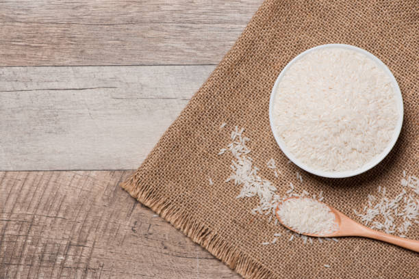 istock Rice in spoon and bowl. Jasmine Rice, Thai Rice, White Rice. 874251562