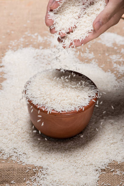 istock Rice in spoon and bowl. Jasmine Rice, Thai Rice, White Rice. 874251638