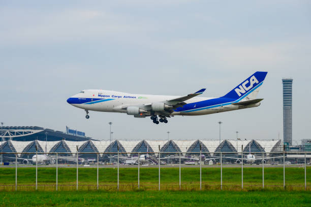 Nippon Cargo Airlines Plane landing to runways at suvarnabhumi international airport in Bangkok ,Thailand. This airport is one of the most populated airports in the world. Bangkok, Thailand - July 30, 2017: Nippon Cargo Airlines Plane landing to runways at suvarnabhumi international airport in Bangkok ,Thailand. This airport is one of the most populated airports in the world. nippon cargo airlines photos stock pictures, royalty-free photos & images