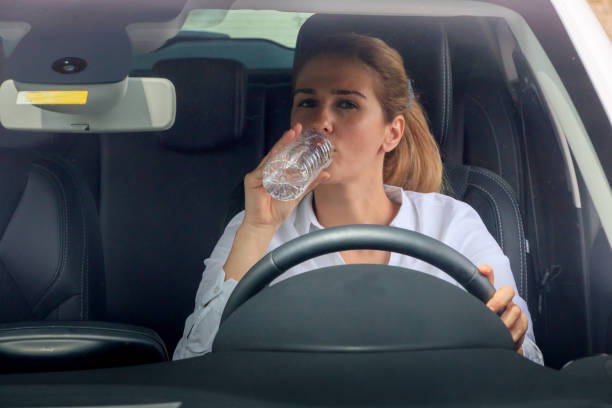 istock Woman is driving her car 874255404