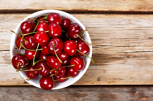 Cherry on a wooden background. View from above. close up