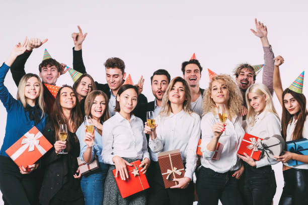 istock Group of people having a party with gift boxes. 874257994