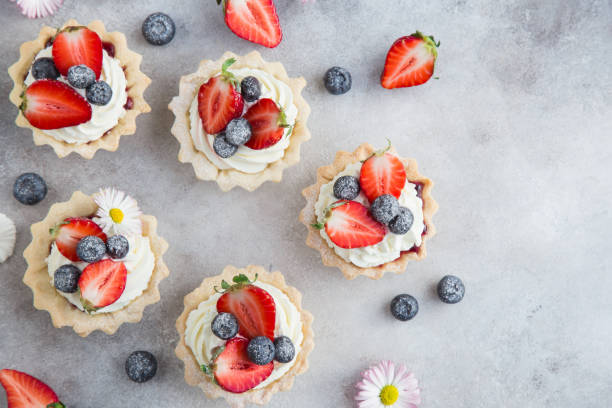 istock tarts with cream cheese and fresh berries 874259406
