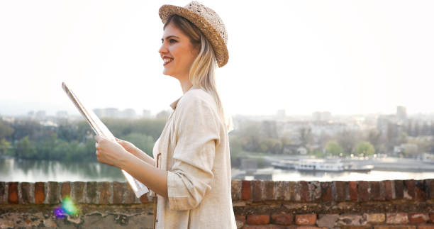 istock Happy blond female traveling and sightseeing 874266168