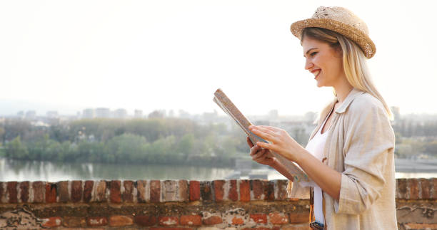 istock Happy female tourist sightseeing and exploring 874266224