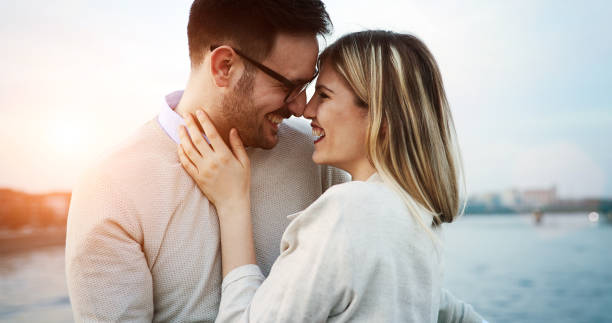 istock Couple kissing dating on bridge 874266686