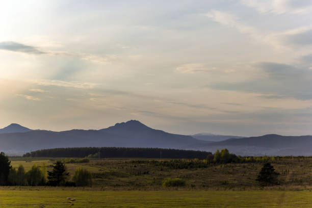 istock Landscape with the Ural mountains at sunset 874277148