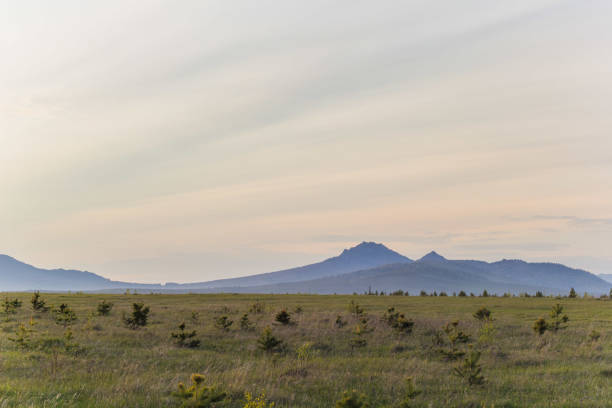 istock Landscape with the Ural mountains at sunset 874277190