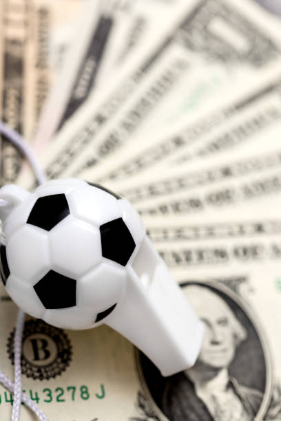 istock soccer whistle on dollar notes, concept sport bets 874279298