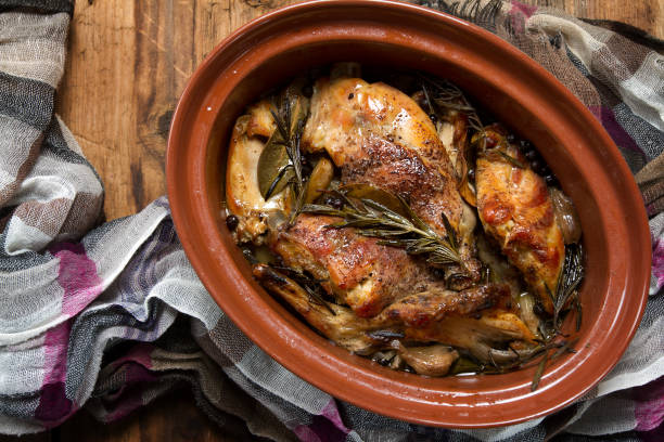 istock Braised rabbit with rosemary, garlic and juniper berries 874279714