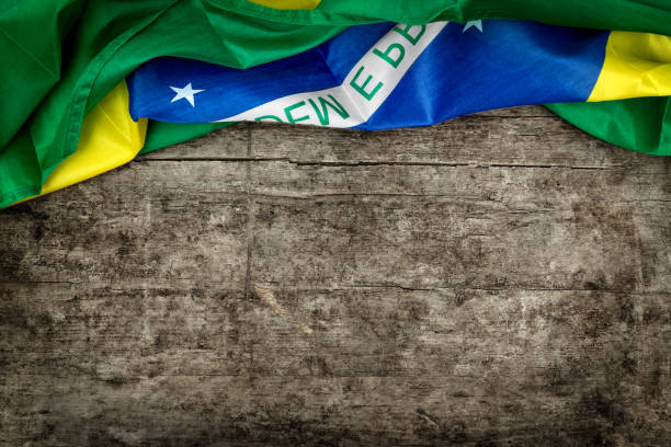 istock brazilian flag on s wooden background 874288508