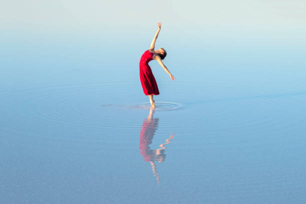 istock young ballet dancing on the lake in the evening 874289936