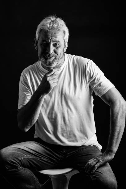 istock Mature man with white hair and beard smiling 874293808